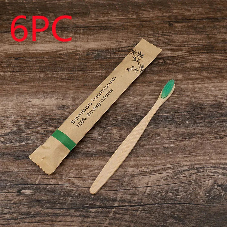 Set of 10 bamboo toothbrushes with charcoal bristles in various colours showing 17.5cm handles