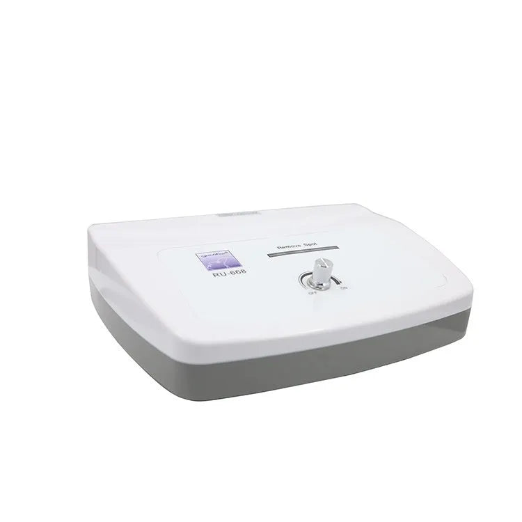 White professional spot and mole removal pen electronic beauty device with power adaptors.