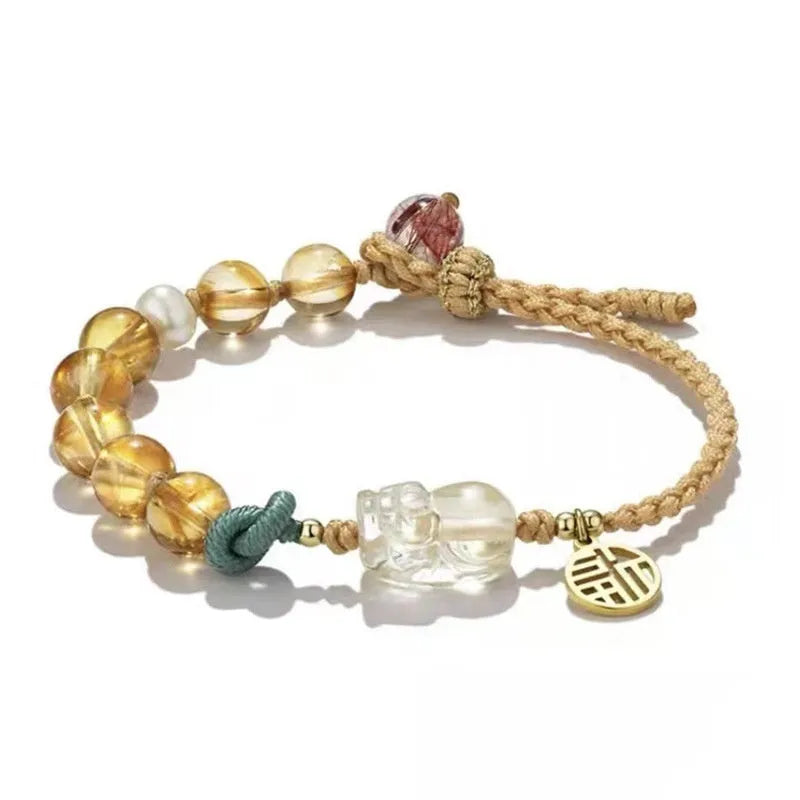Hand-woven crystal bracelet with animal zodiac design in citrine colour