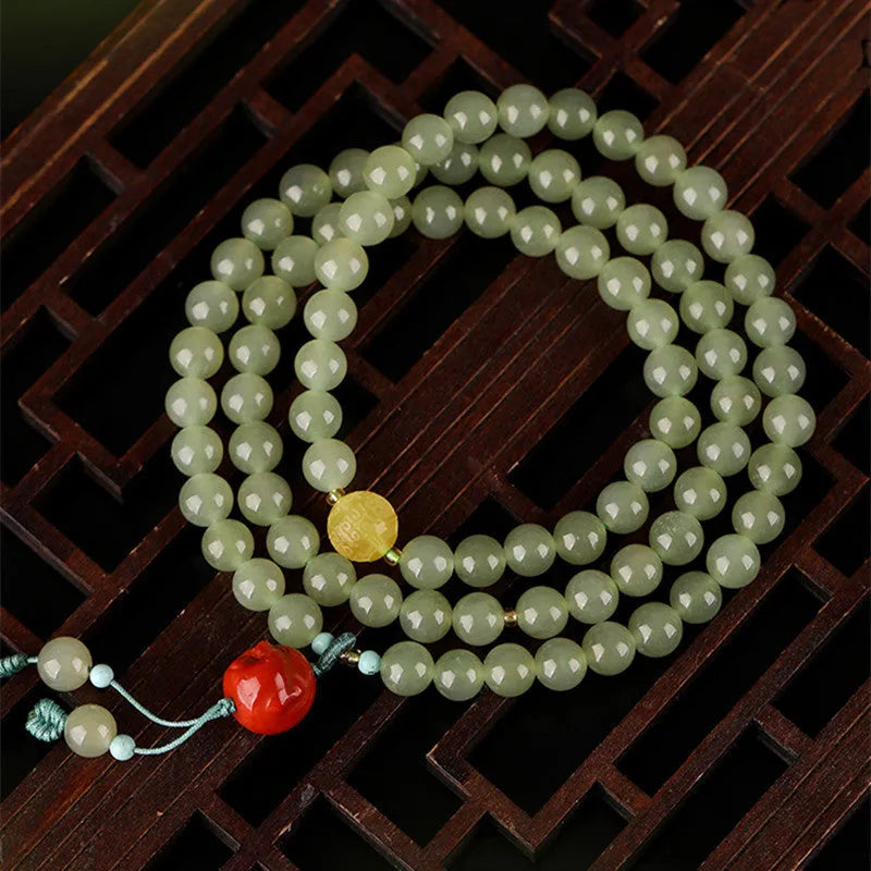 Pale blue Hetian jade bracelet with three circle design measuring 6mm diameter