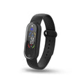 Black and white electronic ultrasonic mosquito repellent bracelet on a wrist.