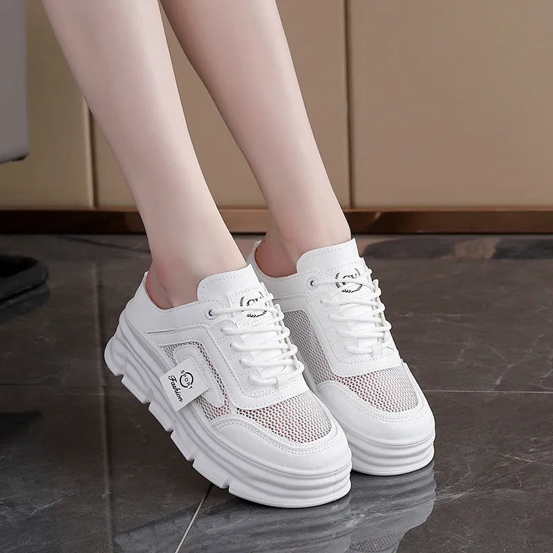 Women's black mesh half slippers with a round toe and rubber sole on a white background.