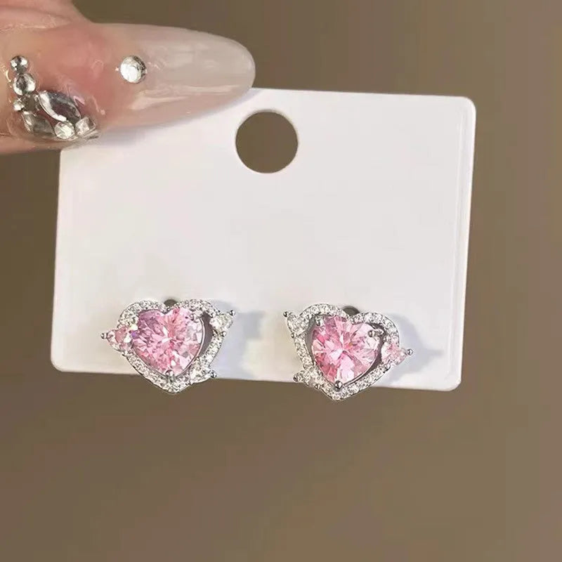 Women's white gold tone heart stud earrings with electroplated copper construction