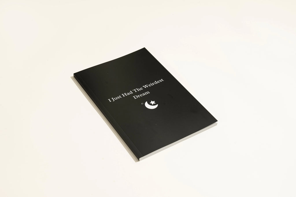 Black A5 hardcover dream journal with 192 unlined pages and a ribbon marker