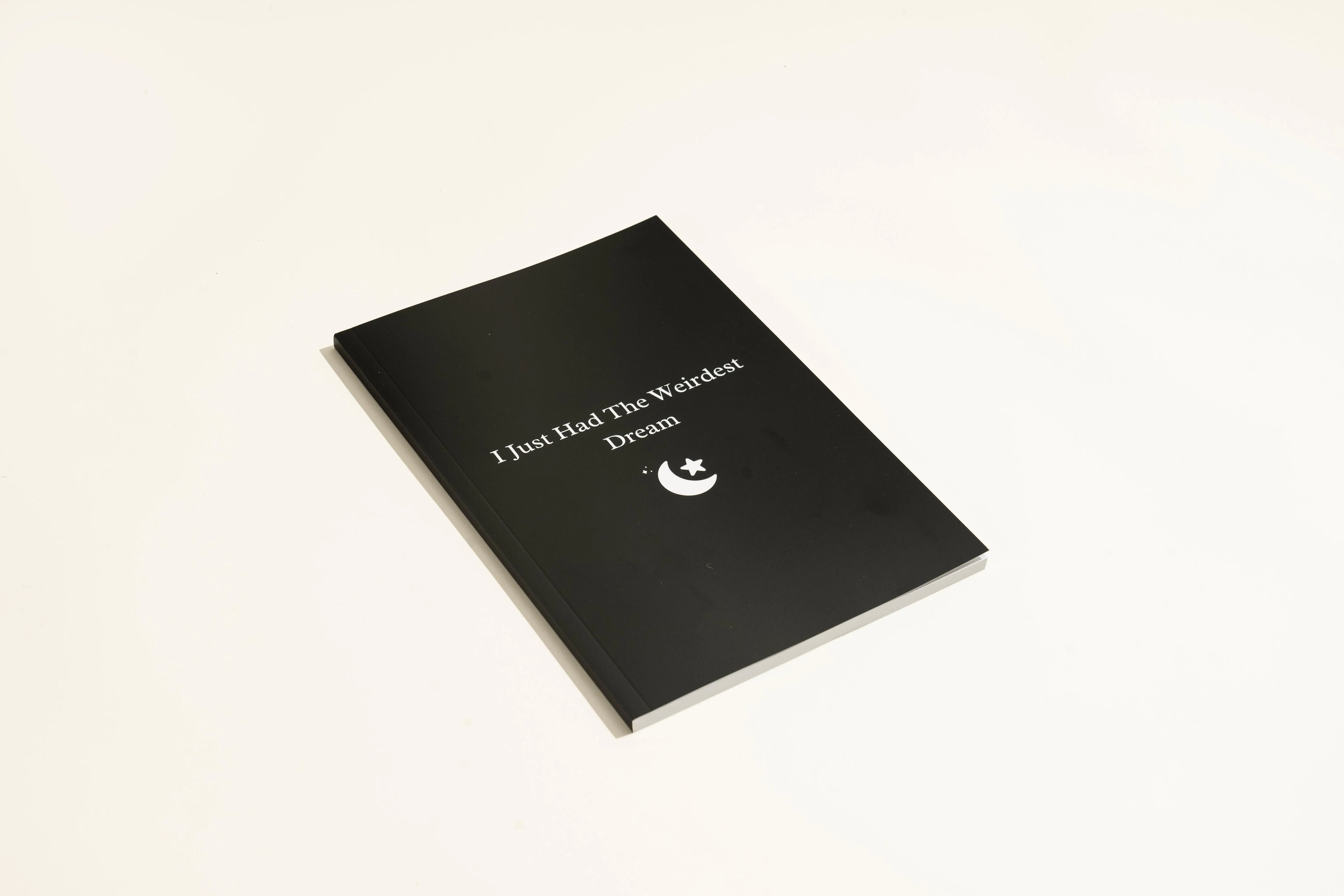 Black A5 hardcover dream journal with 192 unlined pages and a ribbon marker