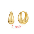 Geometric brass earclip earrings with electroplated golden finish and round elements