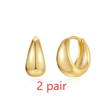 Geometric brass earclip earrings with electroplated golden finish and round elements