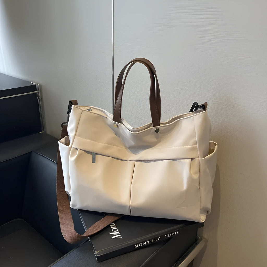 Nylon crossbody tote bag with shoulder strap in black, grey, white, or green