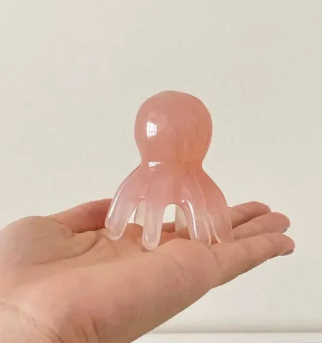 Pink natural resin octopus massage comb for facial tension relief with storage bag