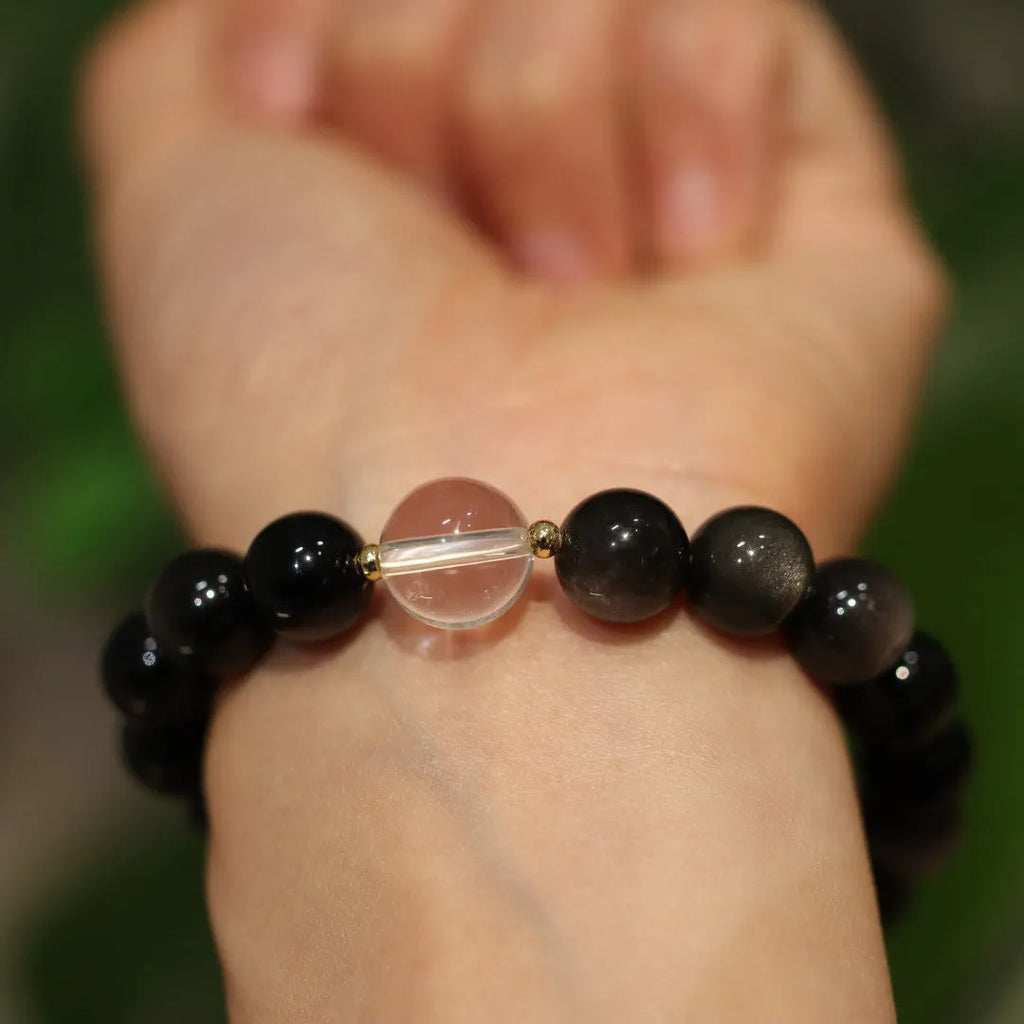 White crystal geometric bracelet with cat eye obsidian stones and Chinese auspicious patterns