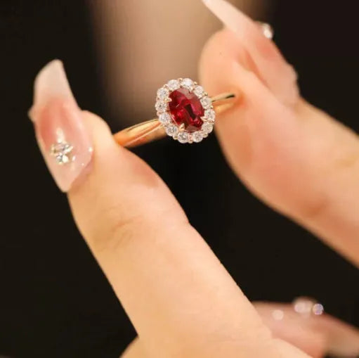 Women's sterling silver ring with gold pigeon blood ruby gemstone and floral pattern design
