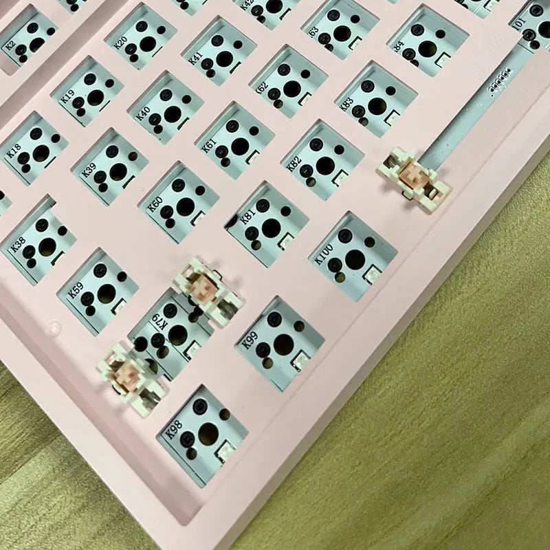 DIY mechanical keyboard kit with hot-swappable seat in multiple colour options including black, white, pink, and transparent cases