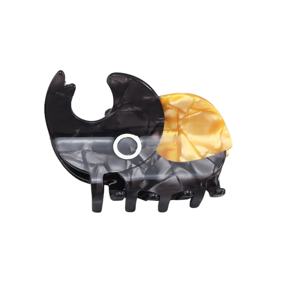 Handmade cartoon insect design hair grip in green beetle, orange beetle, or white caterpillar colour on cellulose acetate.