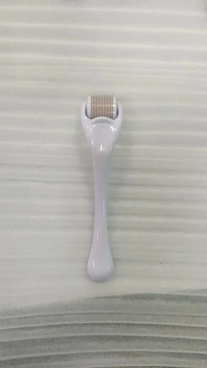 540 micro needle roller with PC handle and coloured wheel showing needle configuration for skin treatment