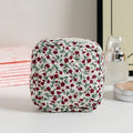 Cute Change women's key storage bag in a floral print made from breathable polyester fabric.