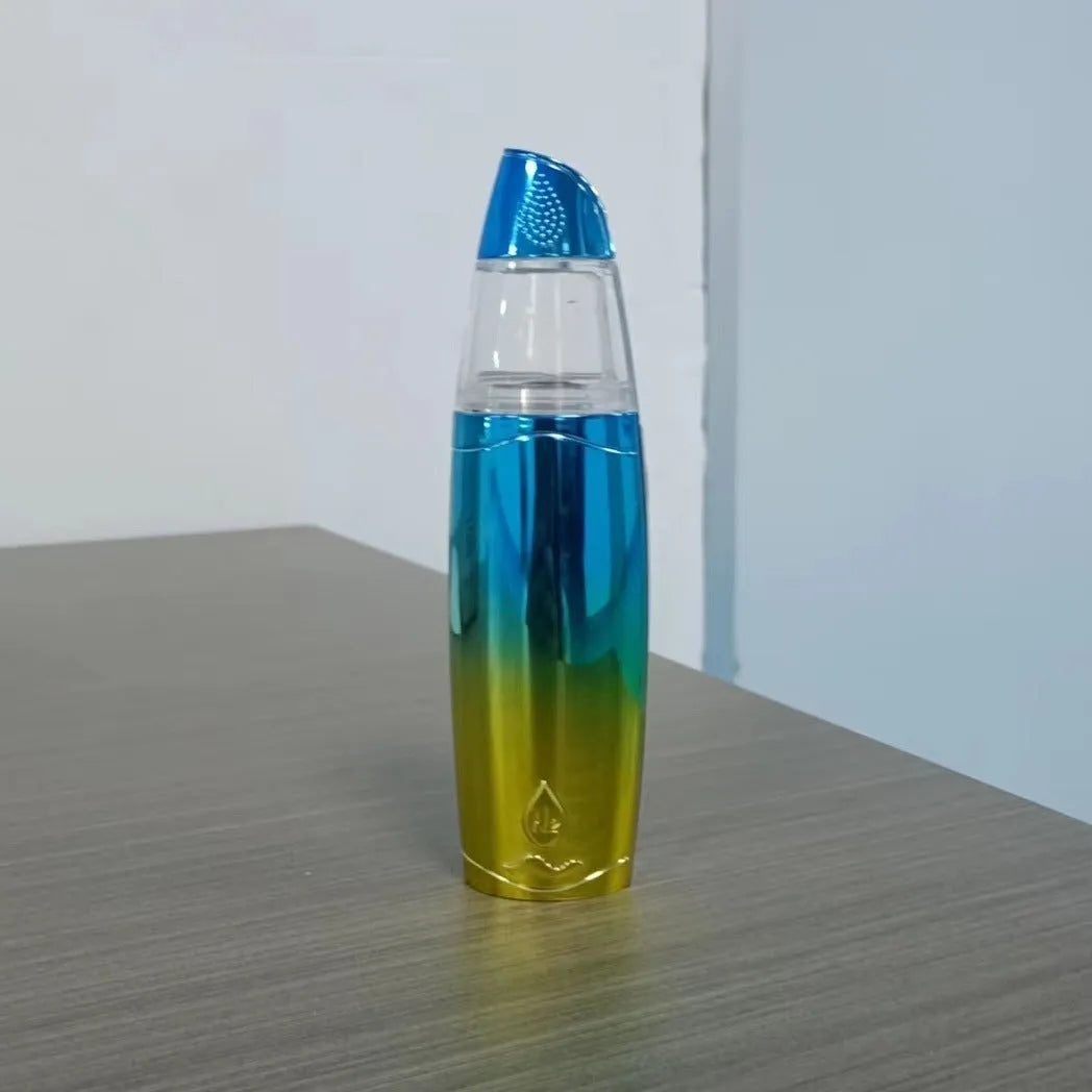 Peacock blue handheld facial steamer with USB charging port producing fine mist