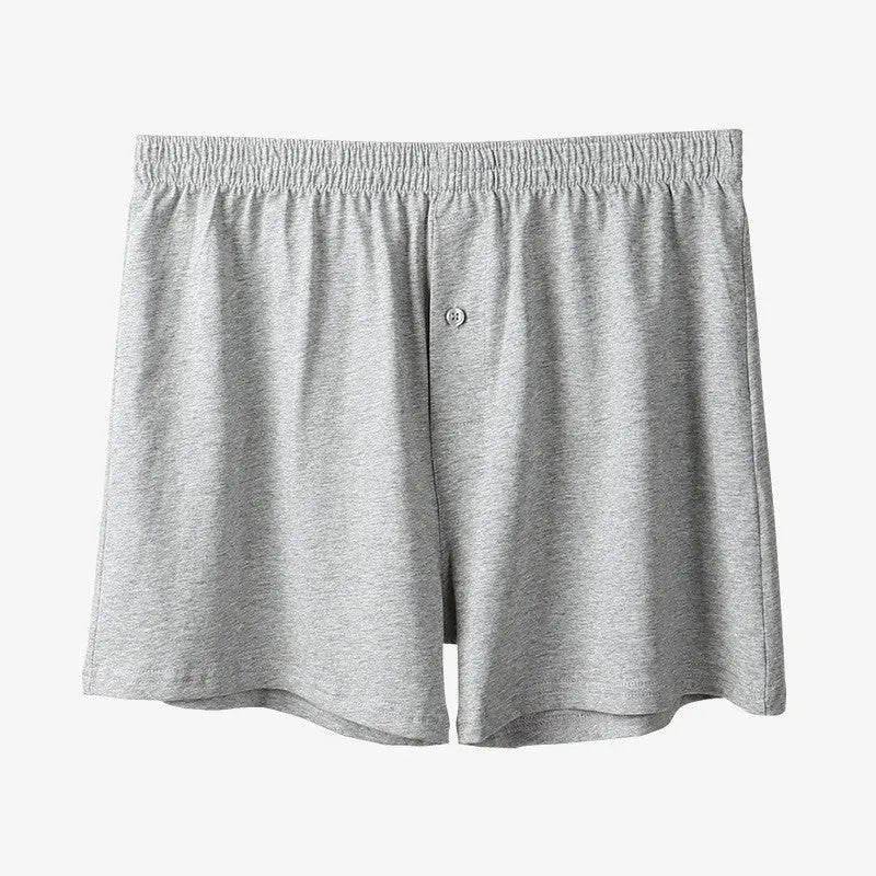 Men's high-waist cotton boxer shorts in light grey, navy blue, and black colours showing knitted fabric texture