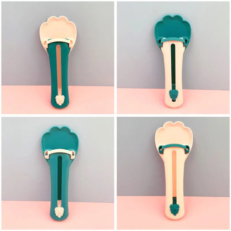 Green and pink pet feed spoon with extrusion design for dispensing cat treats and liquid food