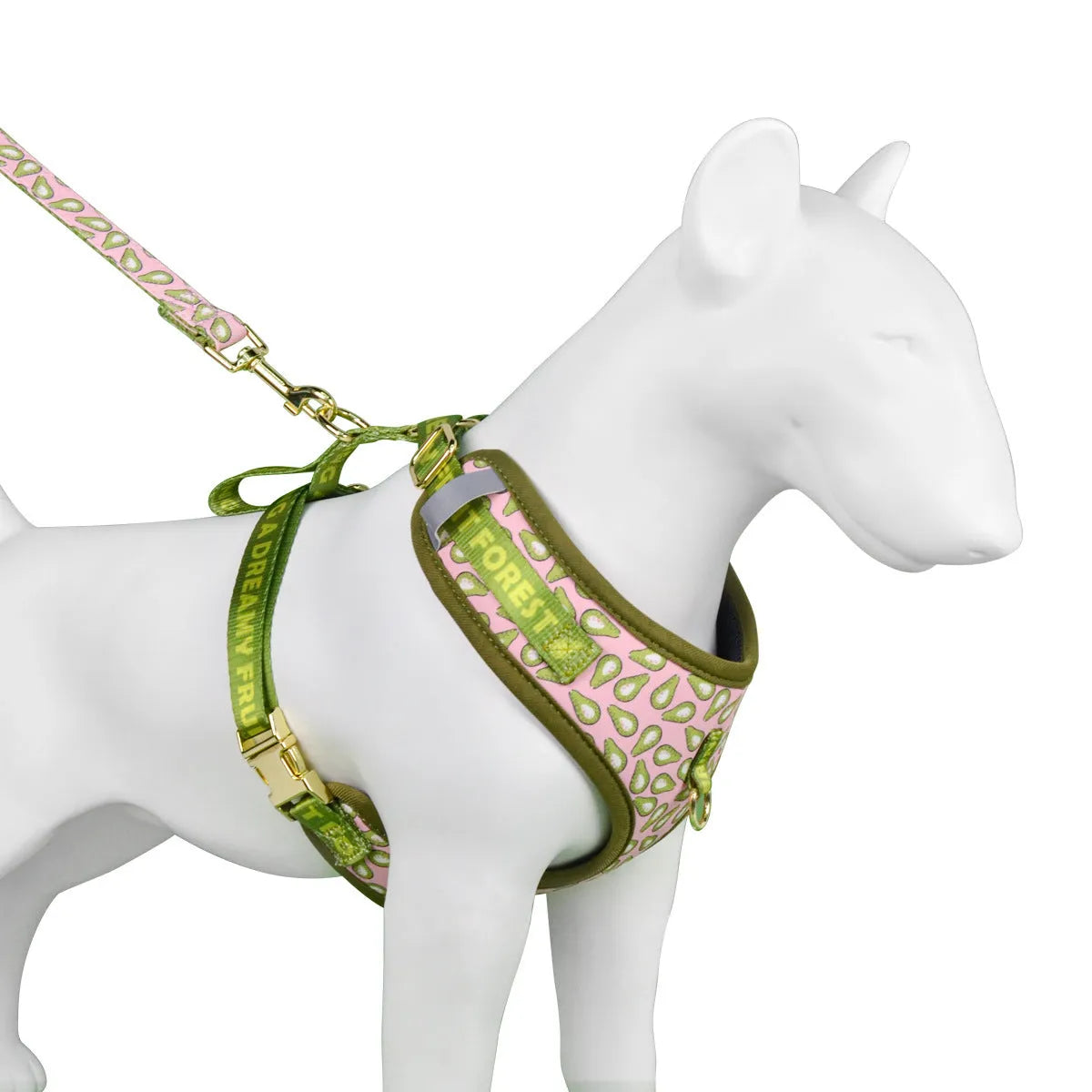 Summer dog harness and lead set in a playful pink avocado print, fitted on a medium-sized dog.