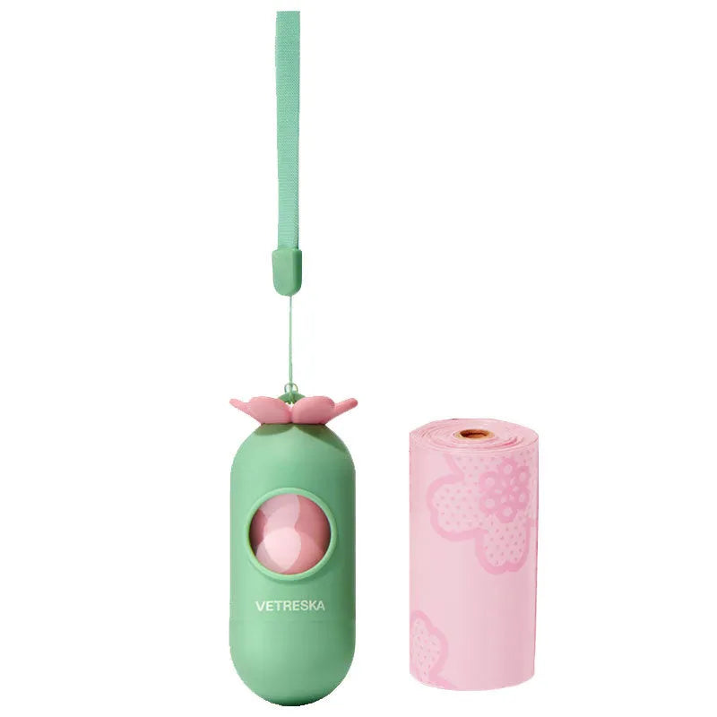 Portable dog poop bag capsule in strawberry, orange, and cherry blossom designs with a roll of scented inner bags.