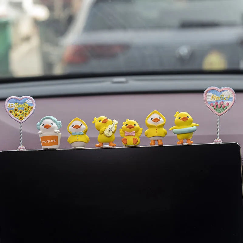 PVC duckling car interior decoration set with six small ducks and one sign on car dashboard
