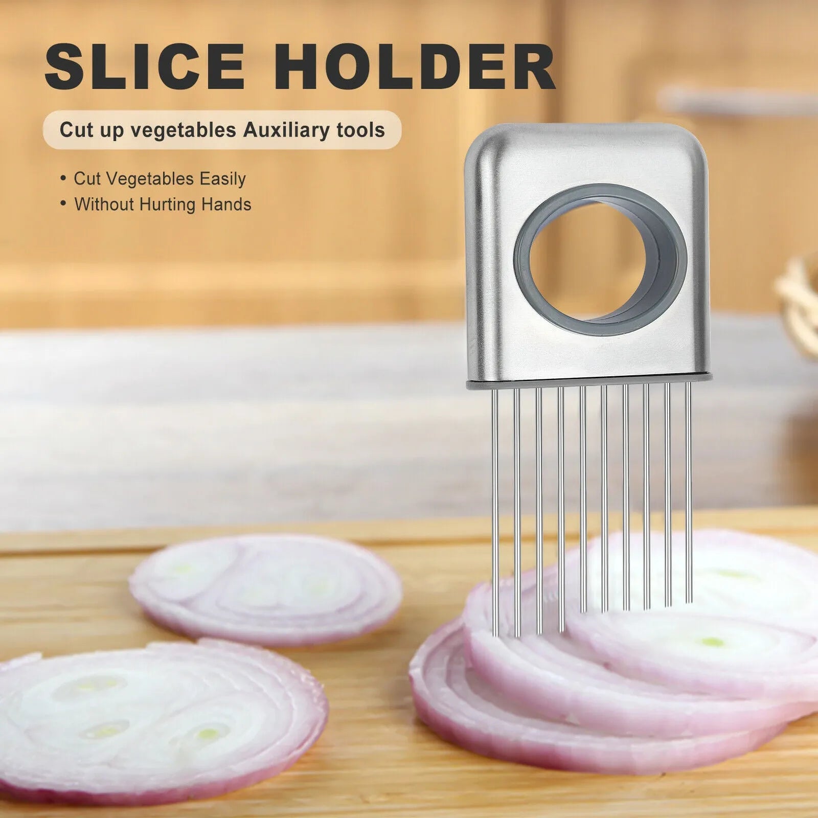 Stainless steel onion holder slicer with sharp prongs and a red finger guard on a kitchen counter.