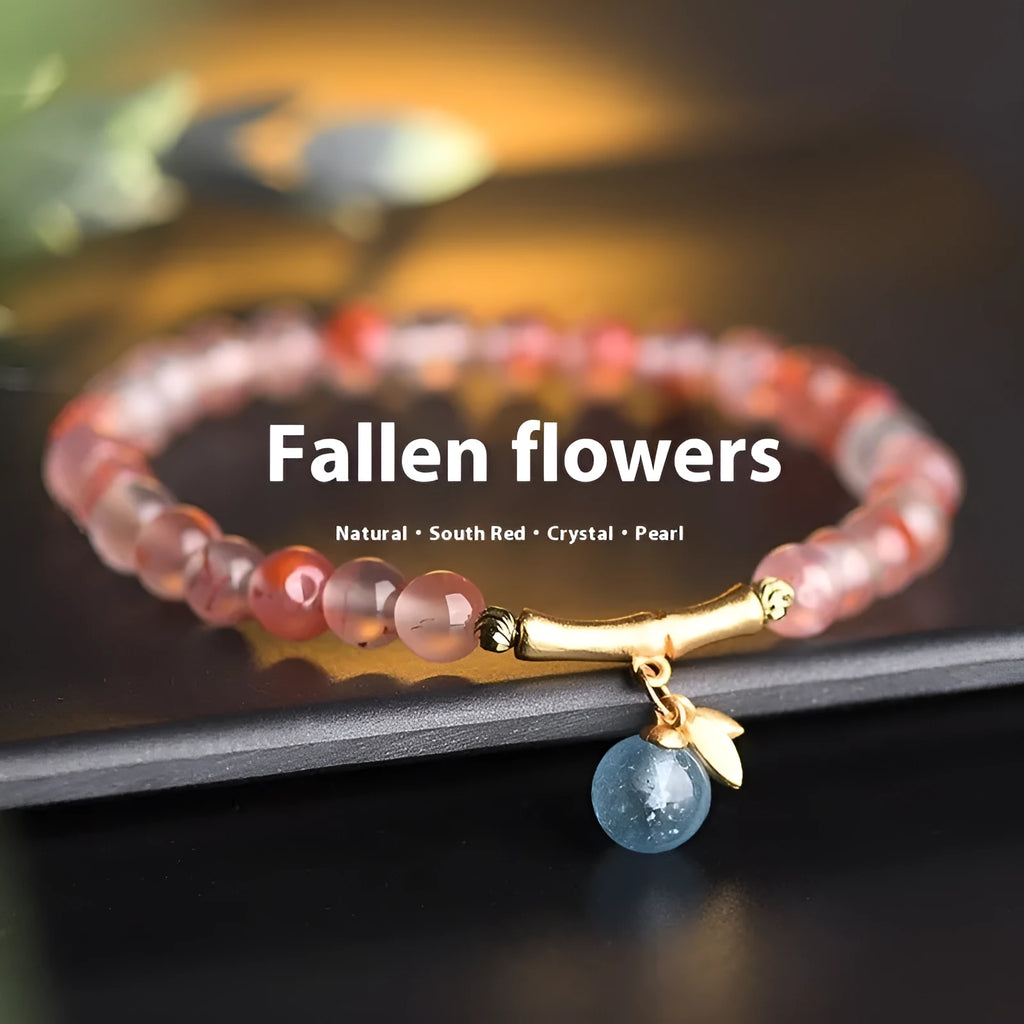 Close-up of a handmade nanhong agate bracelet with a flower design and bamboo joint detail.