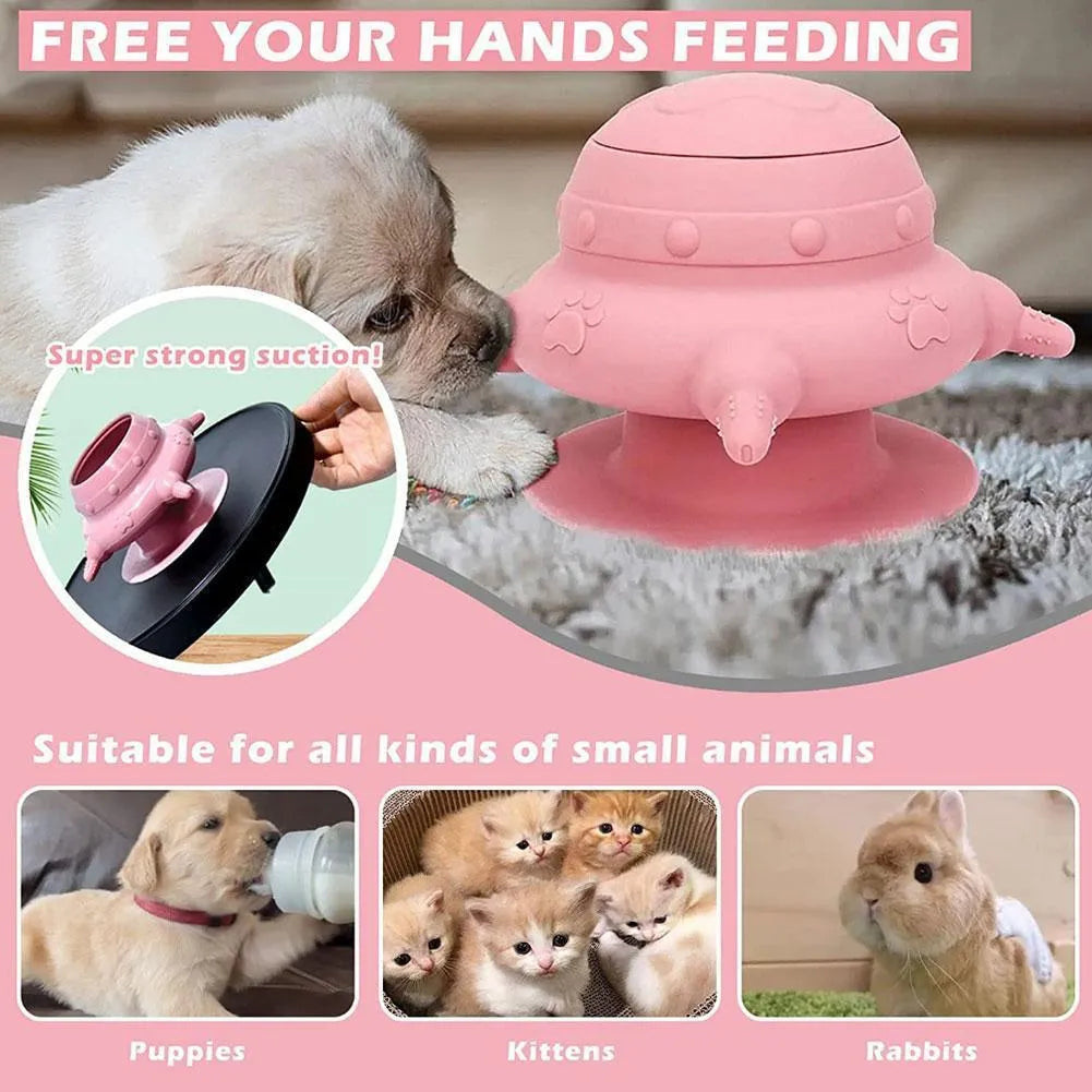 Pink silicone pet milk feeder with pacifier on a flat base, for puppies and kittens.