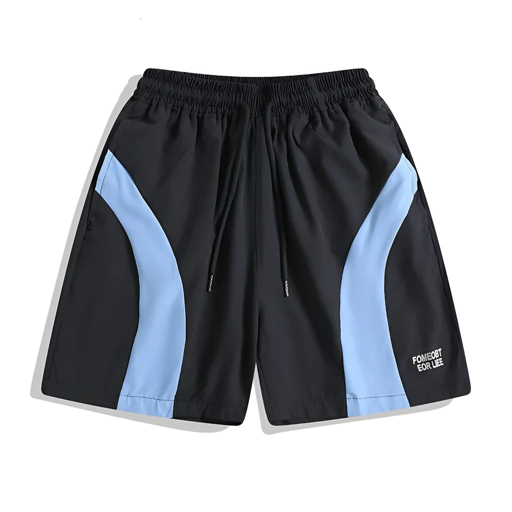 Loose-fit quick-drying sports shorts in black with elastic waistband and above-knee length