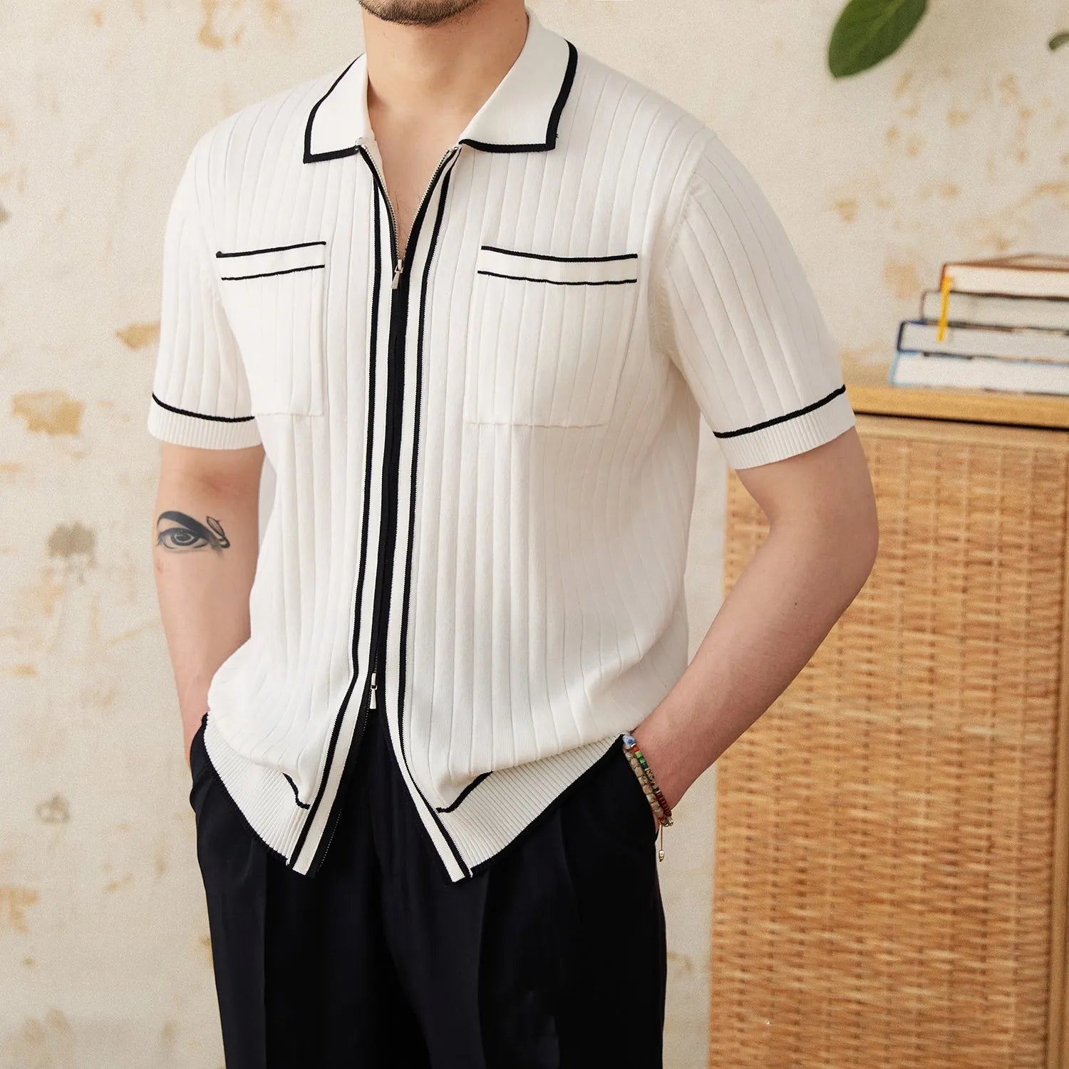 Black lapel collar short sleeve polo shirt on hanger showing slim fit and button placket