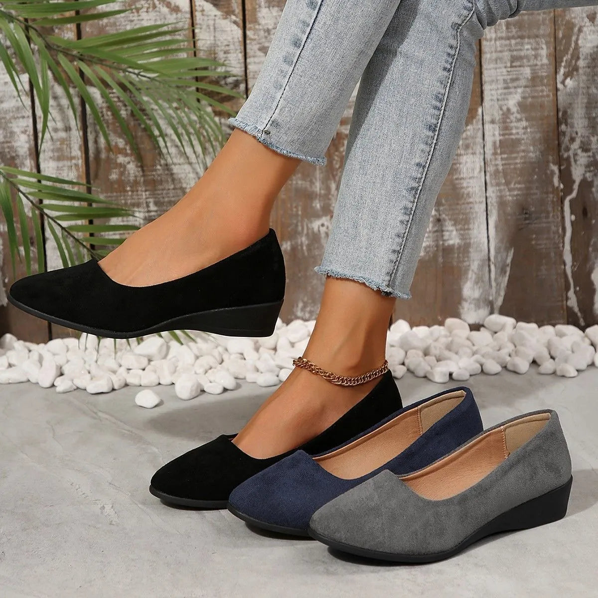 Women's plus size pointed toe wedge pumps with suede upper and low heel in black, blue, gray, khaki, or light brown.