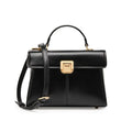 Black leather women's shoulder bag with clasp closure showing internal zippered compartment and adjustable strap