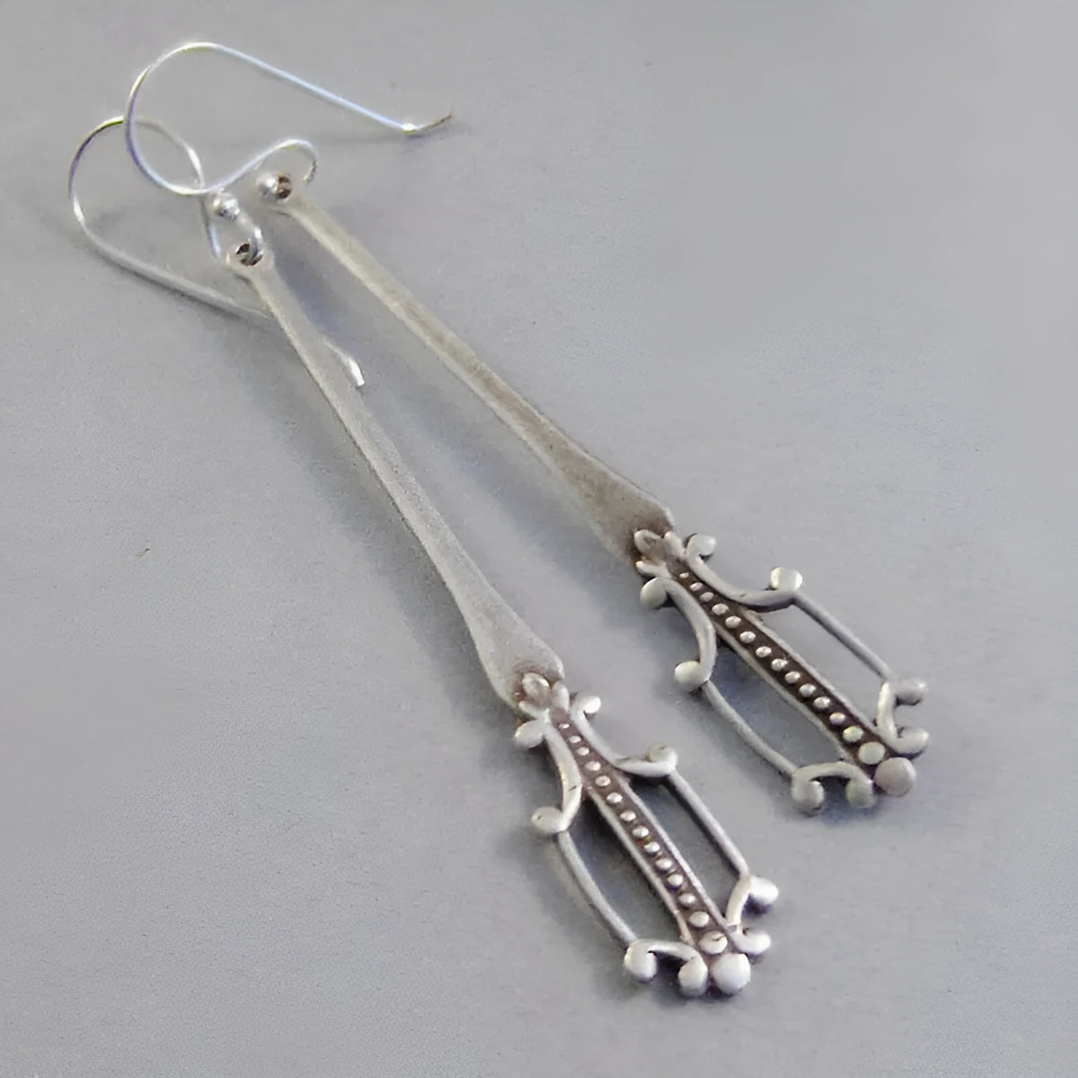 Silver retro geometric alloy earrings for women with electroplated finish, one pair
