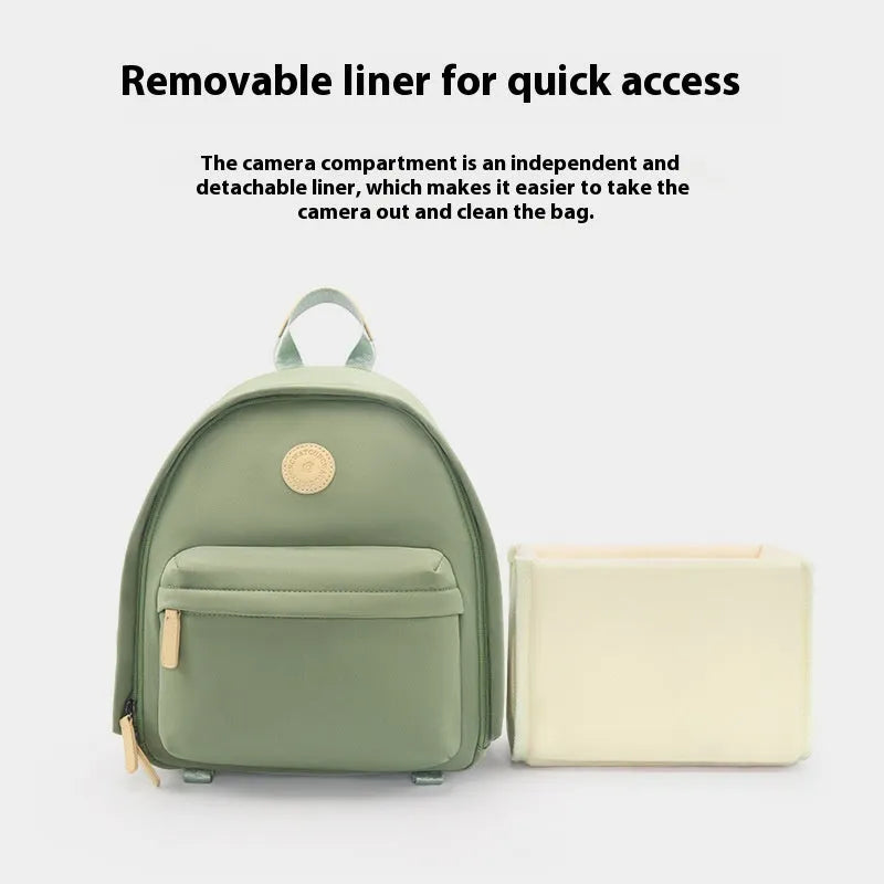 Green polyester shoulder camera bag for women with a curved strap and front patchwork panel.