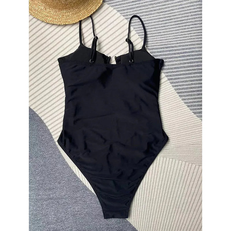 Black solid colour women's one-piece swimsuit with a tight fit