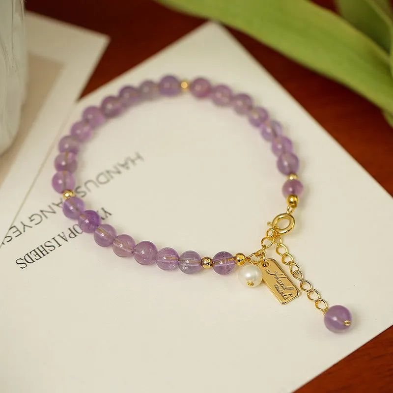 Natural lavender amethyst crystal bracelet with zodiac motifs and adjustable clasp in light or dark colour options