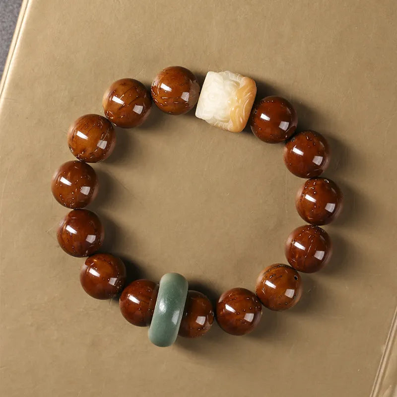 Hand-woven ivory nut lion round bead artistic bracelet with 13mm spherical beads