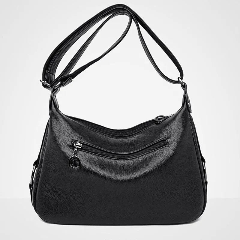 Large blue PU leather women's crossbody bag with zipper closure showing internal organiser pockets