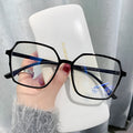 Women's flat glasses with plate frame and AC lenses, shown in black, transparent blue, grey, or tea colour options