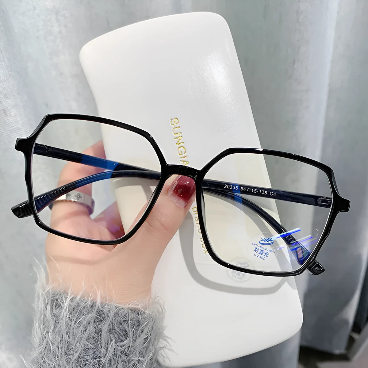 Women's flat glasses with plate frame and AC lenses, shown in black, transparent blue, grey, or tea colour options