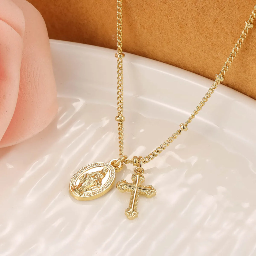 Gold geometric cross necklace on a 45cm chain with adjustable clasp