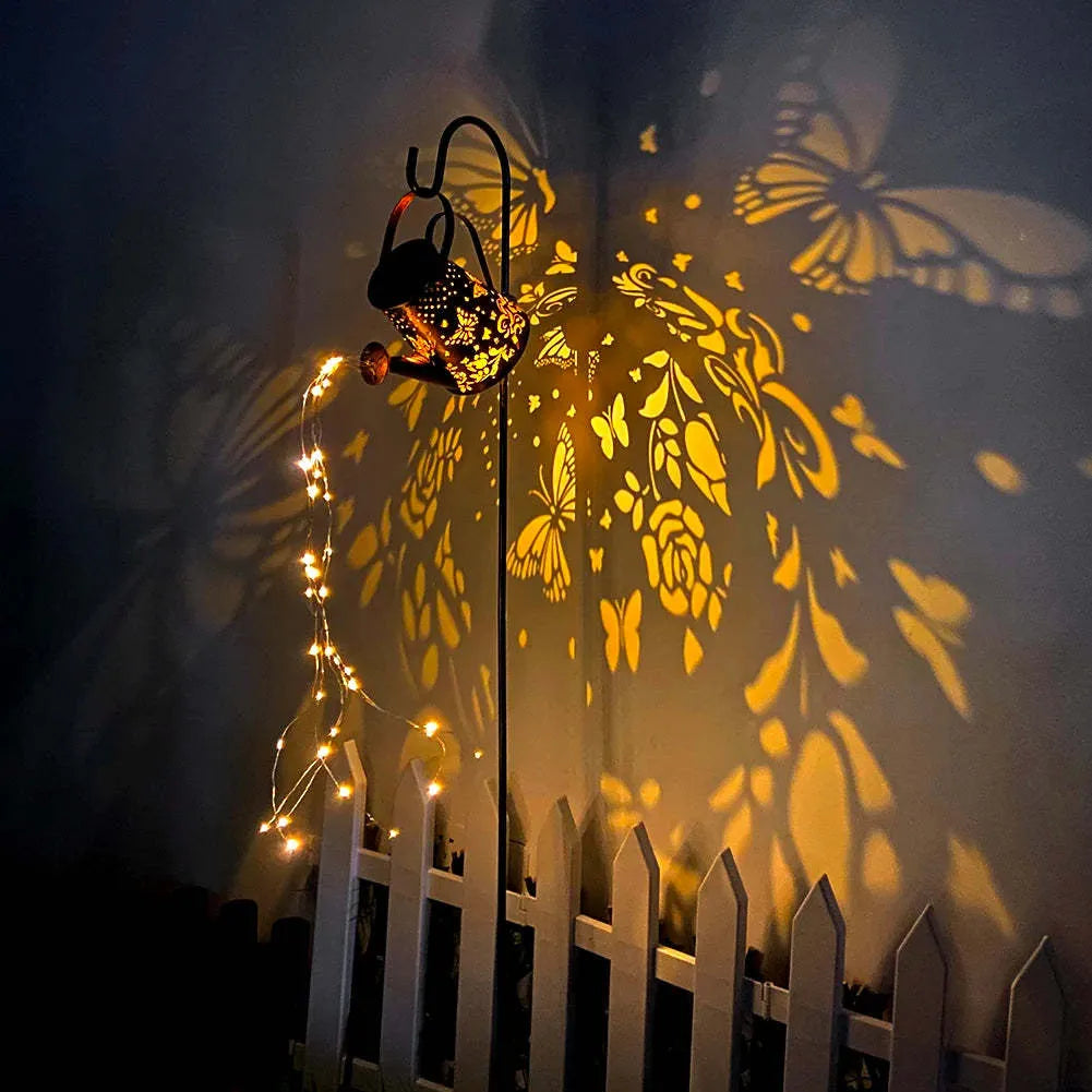 Solar-powered iron garden lamp with tapered butterfly design and warm white LED illumination