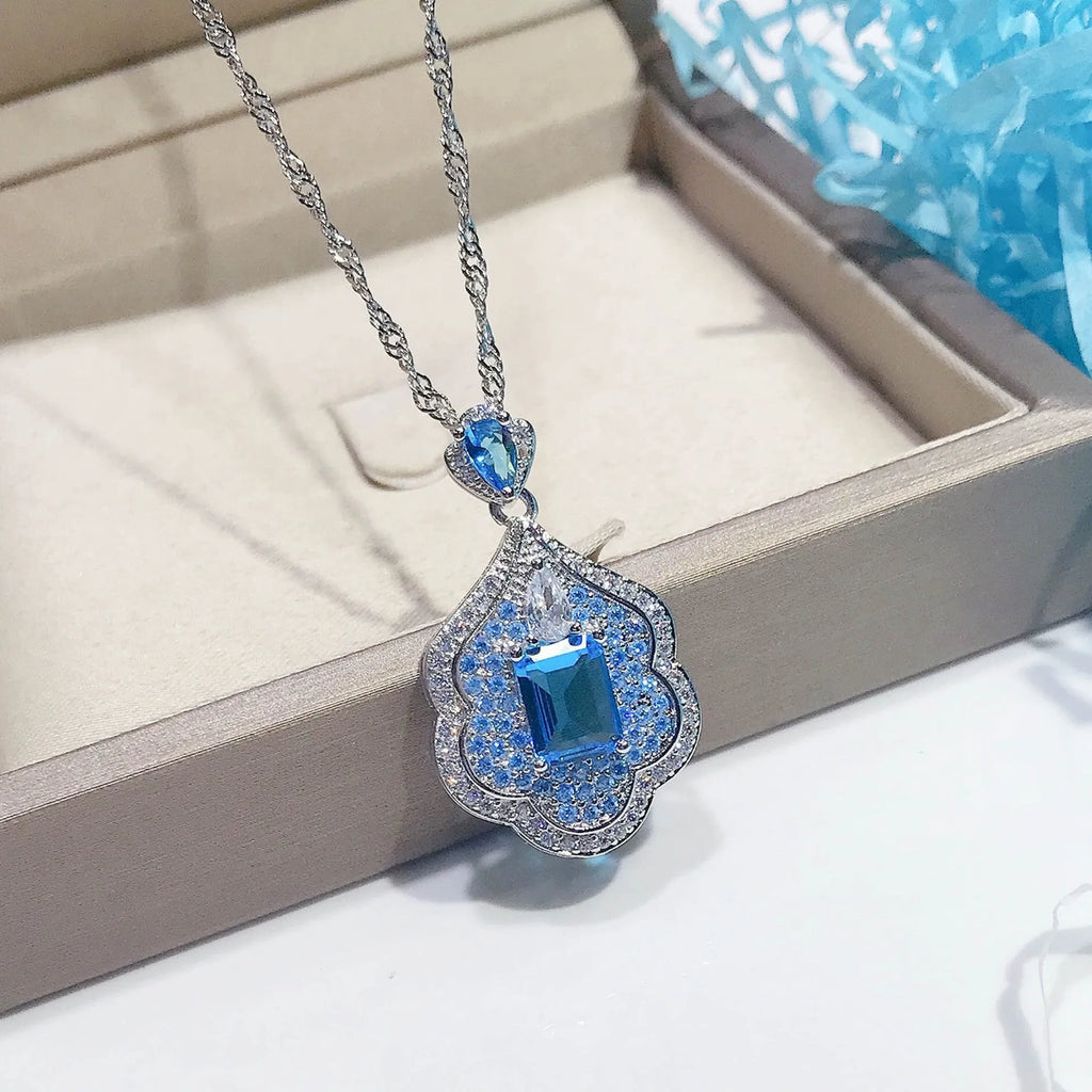Sea blue geometric copper pendant charm with aquamarine topaz colour for DIY jewellery