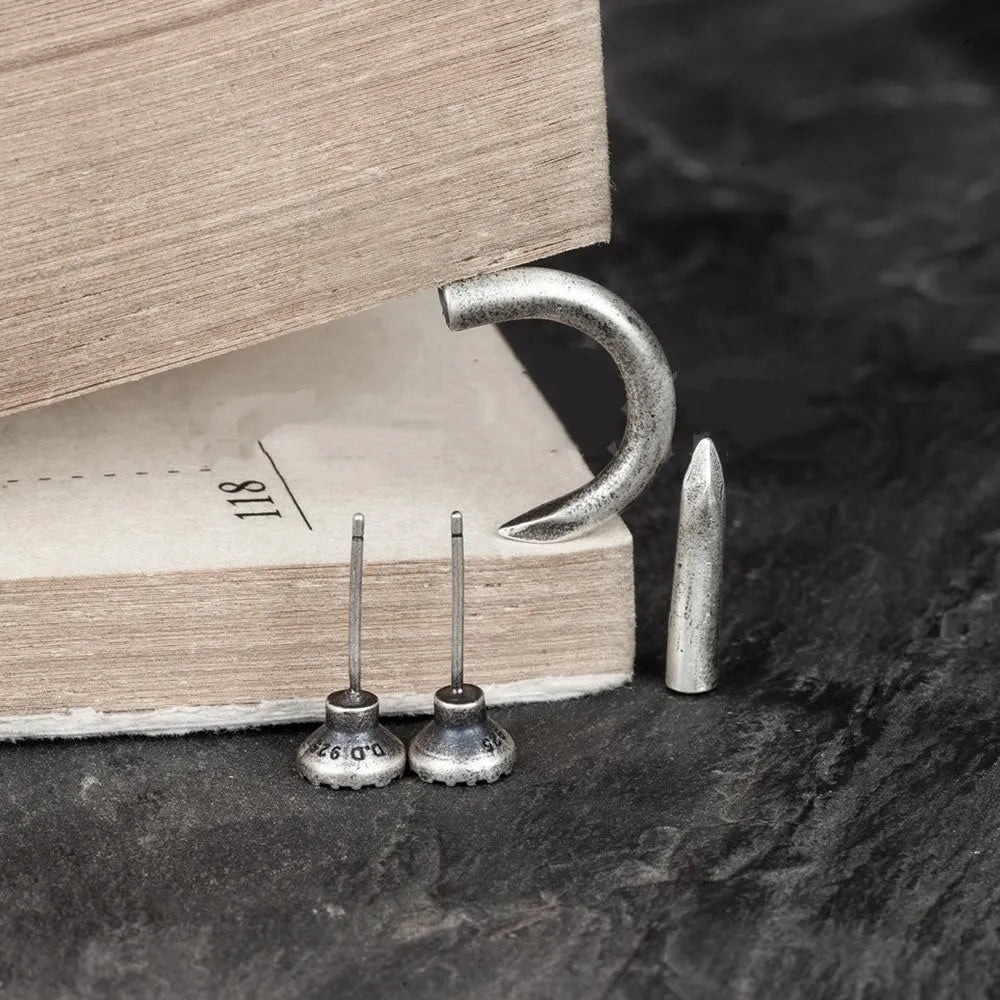 S925 sterling silver nail earrings with ear hook, showing straight and curved nail designs in punk style