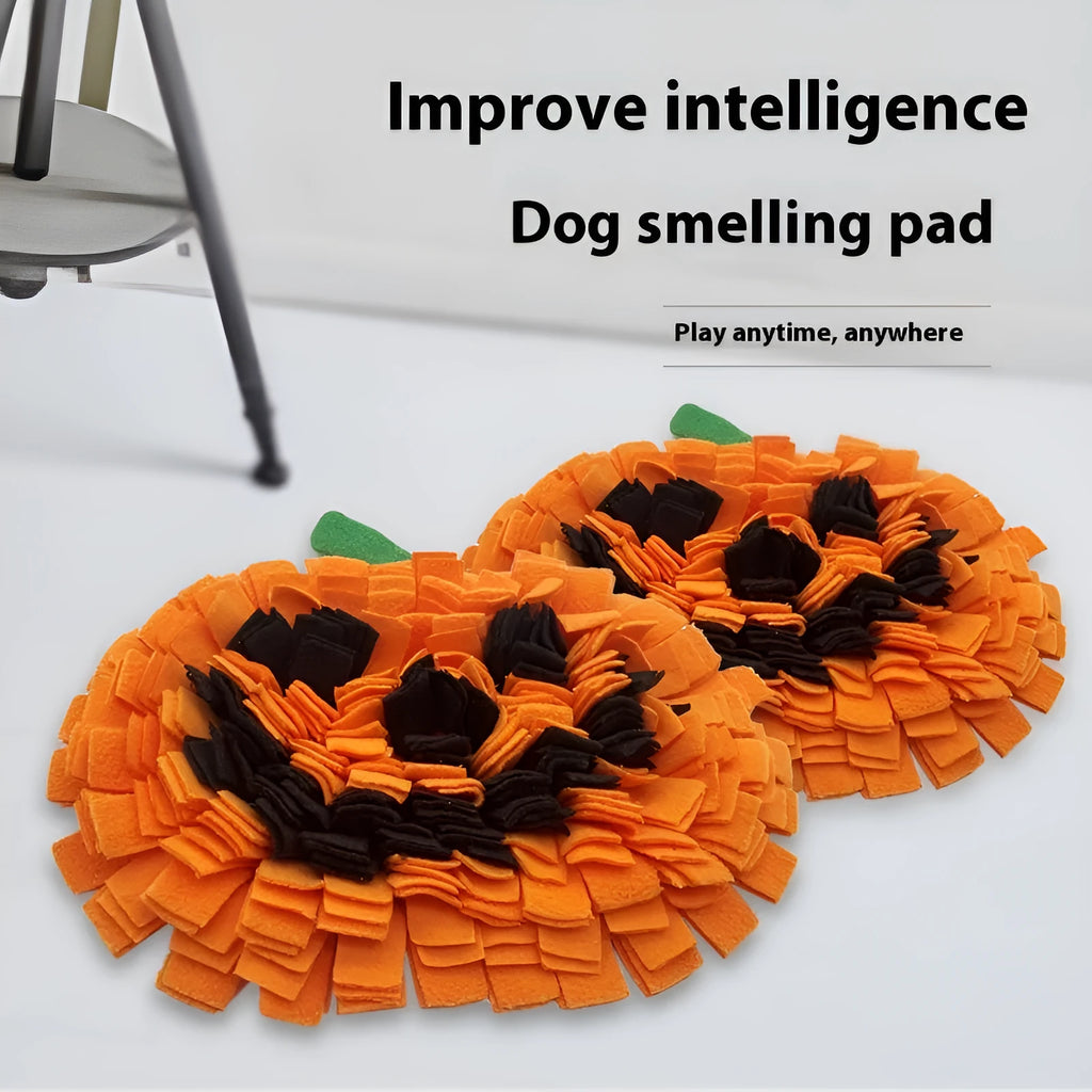 Orange pumpkin-shaped polar fleece pet lick mat for slow feeding and dog training.