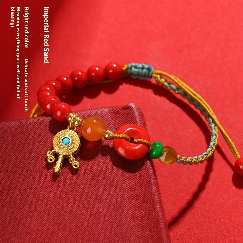 Hand-woven cinnabar bracelet with geometric peace blessing buckle in emperor red sand colour