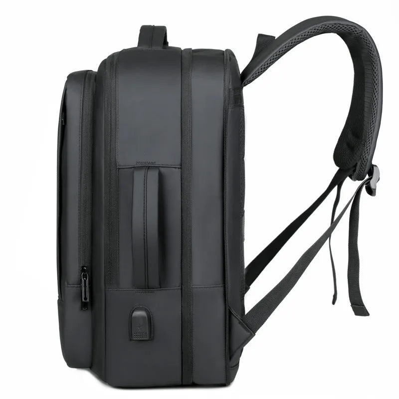 Black waterproof business backpack with 20-35L capacity and curved shoulder strap for commuting