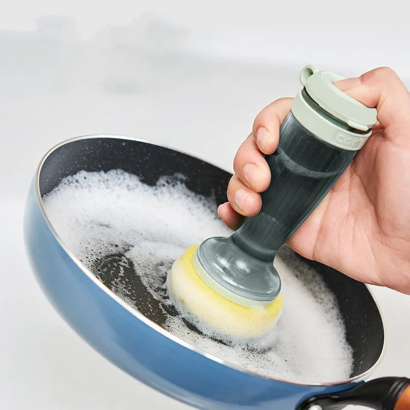 Milk white and mint green kitchen pot brush with soap dispenser in handle and replaceable brush head.