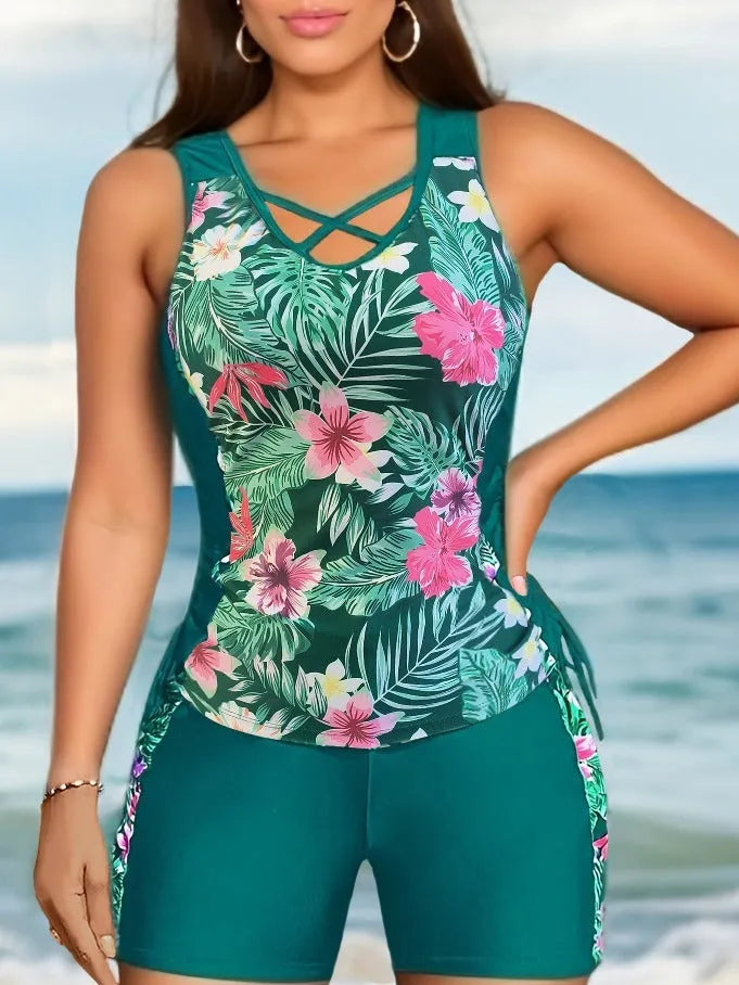 Plus-size woman modelling a high-waisted floral print bikini in blue, for swimming.