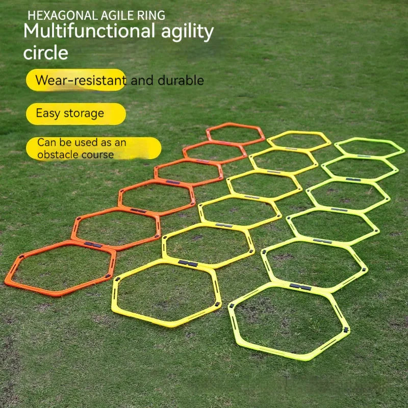 Set of six foldable yellow hexagon plastic agility training rings laid out on grass.